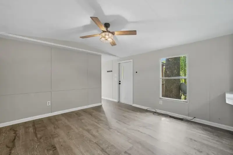 Open living area with wood-look floors at 330 Hyde Road